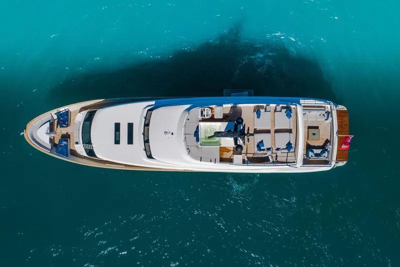 Phoenix Yacht Photos Pics Aerial view of 2019 Sanlorenzo SD112 yacht on turquoise water.