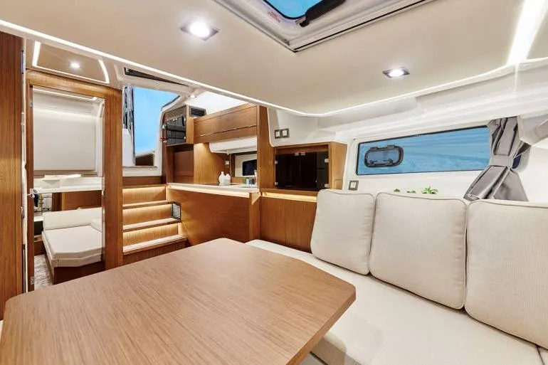  Yacht Photos Pics Luxurious interior of 2023 Jeanneau Leader 12.5 WA yacht with modern furnishings.