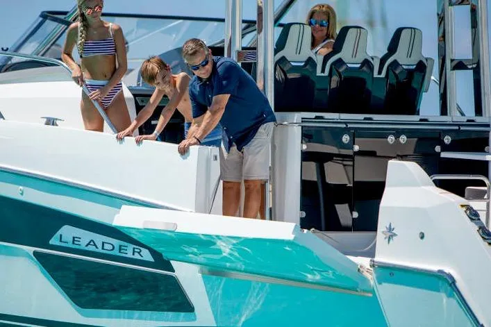  Yacht Photos Pics 2023 Jeanneau Leader 12.5 WA boat with people enjoying a sunny day on the water.