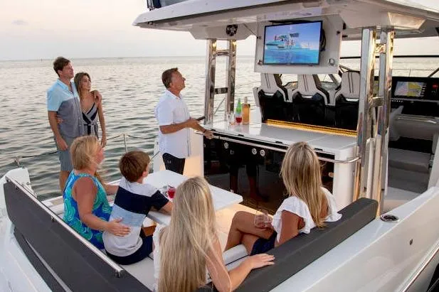  Yacht Photos Pics Family enjoying leisure time on a 2023 Jeanneau Leader 12.5 WA yacht.
