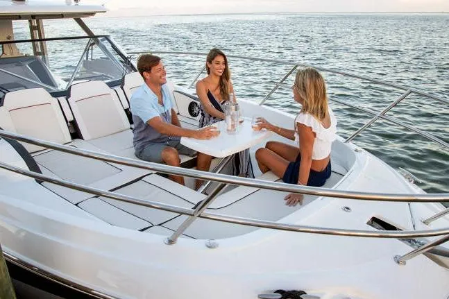  Yacht Photos Pics 2023 Jeanneau Leader 12.5 WA with people enjoying a boat ride on the water.