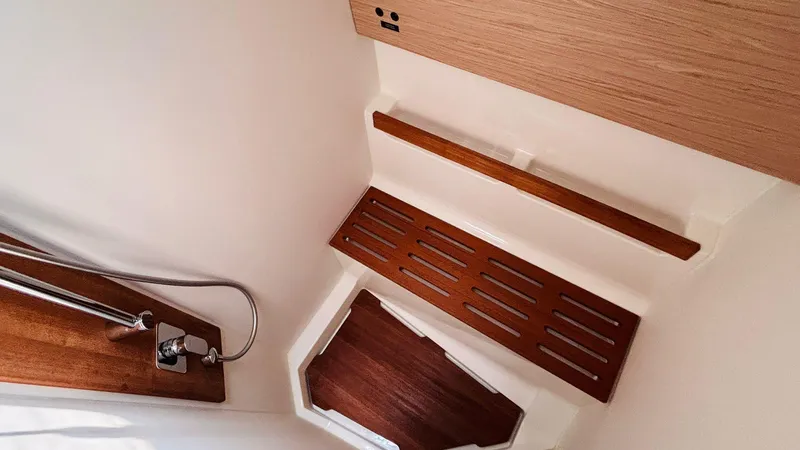  Yacht Photos Pics Interior of 2024 Beneteau Oceanis Yacht 54, featuring sleek wooden shower details.