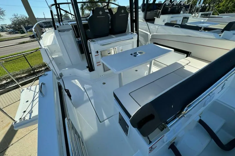  Yacht Photos Pics 2025 Jeanneau Leader 9.0 WA Series 2 boat interior with seating and table.