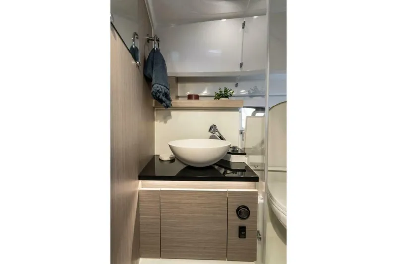  Yacht Photos Pics Modern bathroom interior of 2025 Jeanneau Leader 9.0 WA Series 2 yacht.