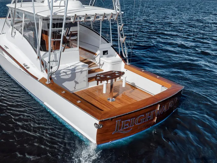  Yacht Photos Pics 1996 Garlington 44 Express boat on water, featuring wooden deck and sleek design.