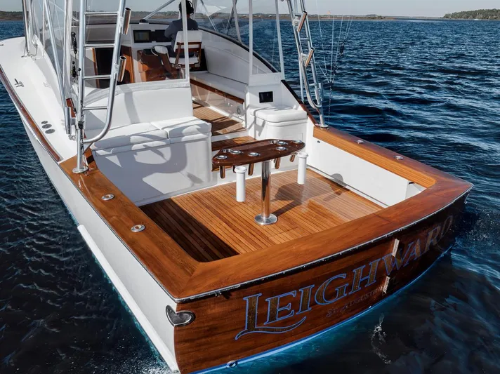  Yacht Photos Pics 1996 Garlington 44 Express yacht on water, featuring a spacious wooden deck.