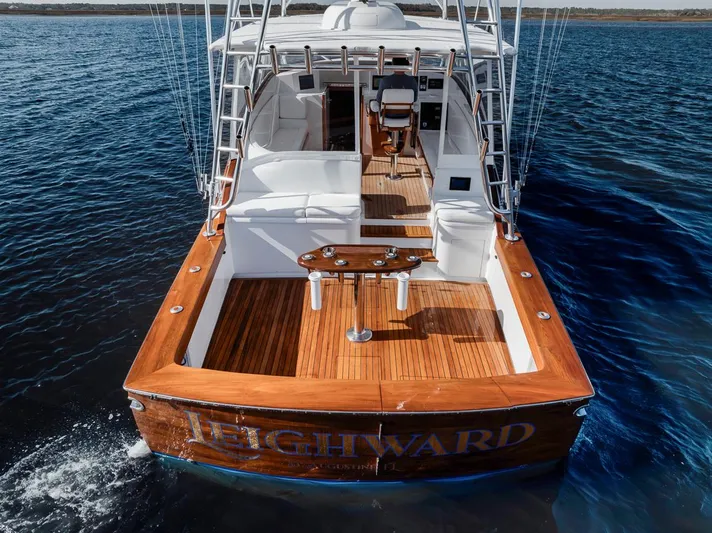  Yacht Photos Pics 1996 Garlington 44 Express yacht on water, featuring a spacious wooden deck.