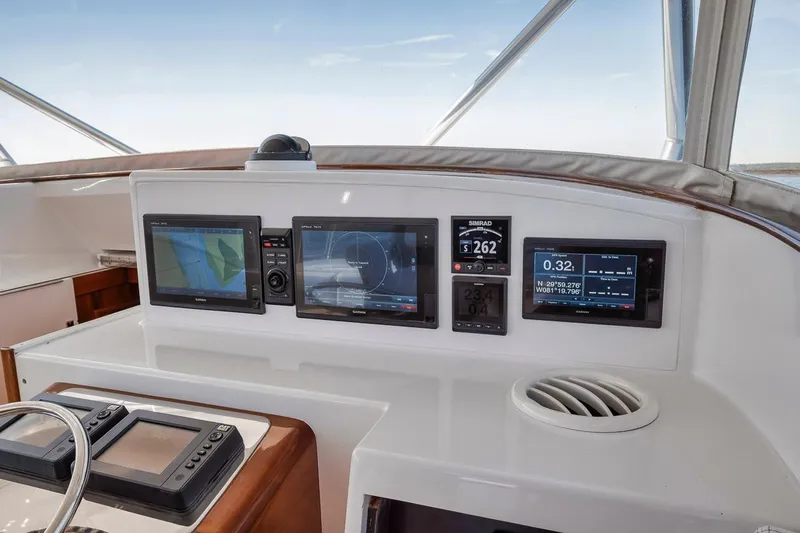  Yacht Photos Pics Garlington 44 Express 1996 yacht dashboard with navigation and control screens.