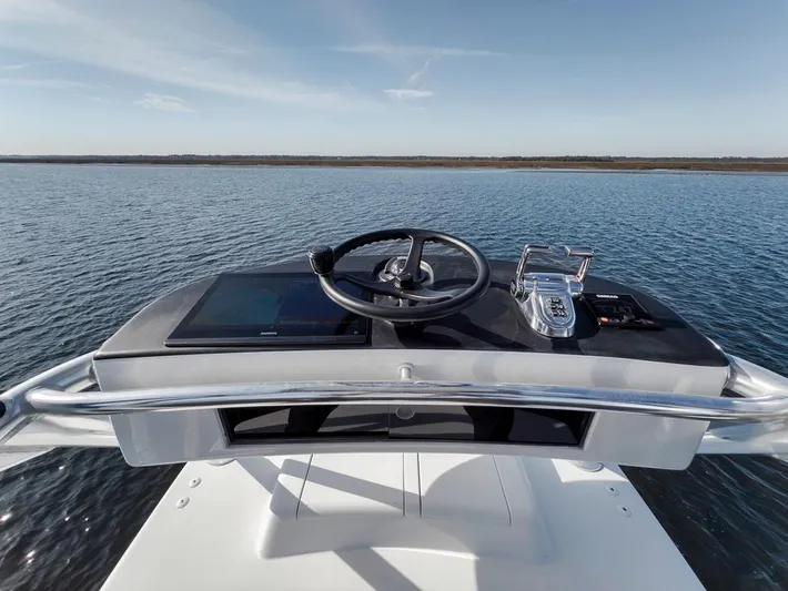  Yacht Photos Pics Helm of 1996 Garlington 44 Express yacht on calm water.