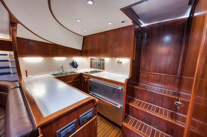  Yacht Photos Pics Luxurious 1996 Garlington 44 Express yacht interior with elegant wood finishes and modern kitchen amenities.