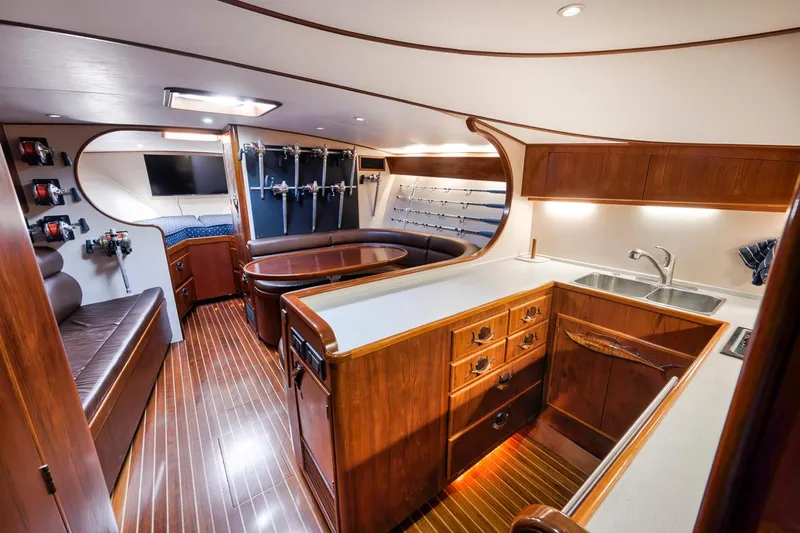  Yacht Photos Pics Luxurious interior of a 1996 Garlington 44 Express yacht with wood finishes and modern amenities.