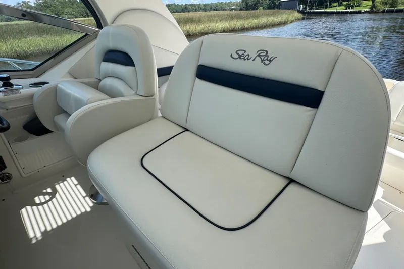  Yacht Photos Pics Luxury seating on 2010 Sea Ray 390 Sundancer boat, featuring elegant white upholstery.