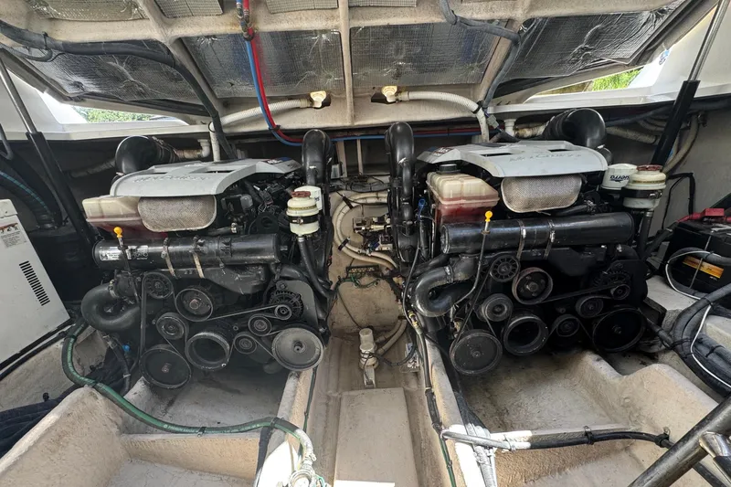  Yacht Photos Pics Engine compartment of 2010 Sea Ray 390 Sundancer, showcasing dual engines and mechanical components.