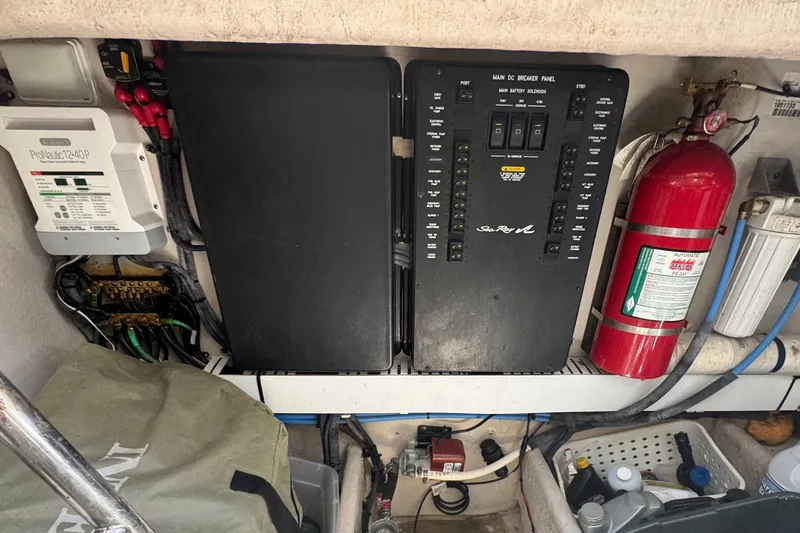  Yacht Photos Pics Engine room of 2010 Sea Ray 390 Sundancer with electrical panel and fire extinguisher.