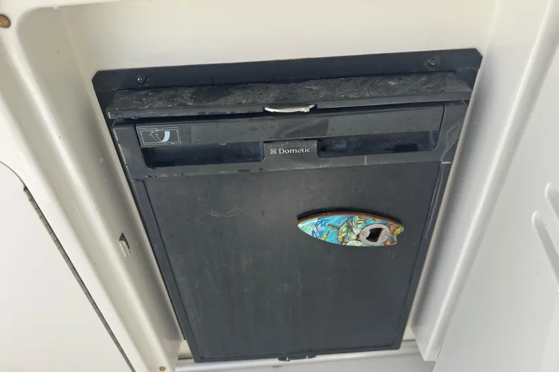  Yacht Photos Pics Dometic refrigerator on 2010 Sea Ray 390 Sundancer boat, featuring a colorful handle.