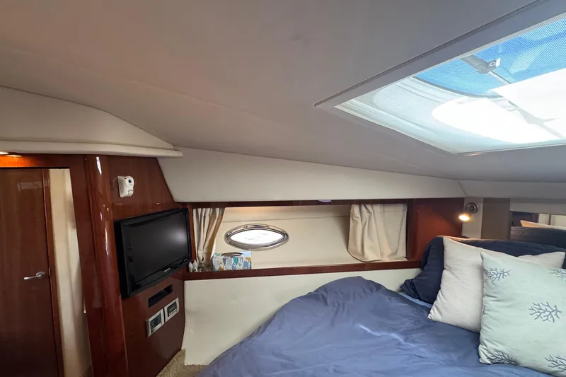  Yacht Photos Pics Interior of 2010 Sea Ray 390 Sundancer yacht with cozy bed and TV.