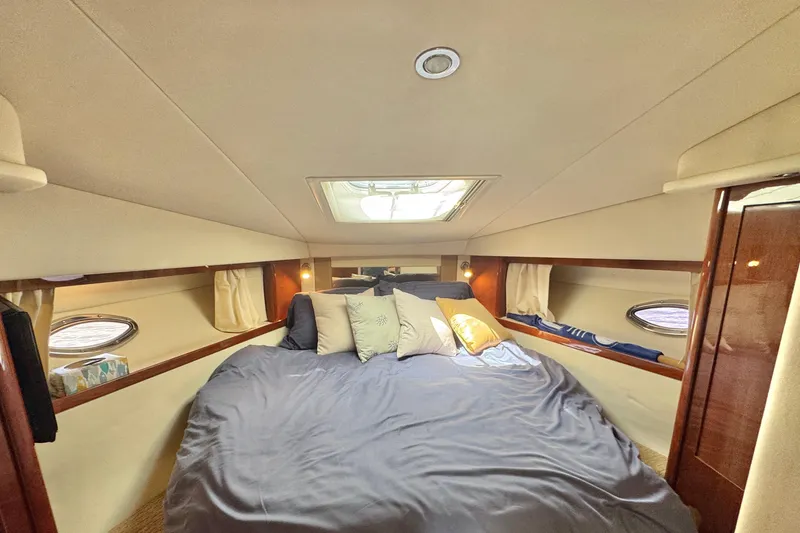  Yacht Photos Pics Luxurious cabin interior of 2010 Sea Ray 390 Sundancer yacht with cozy bedding.