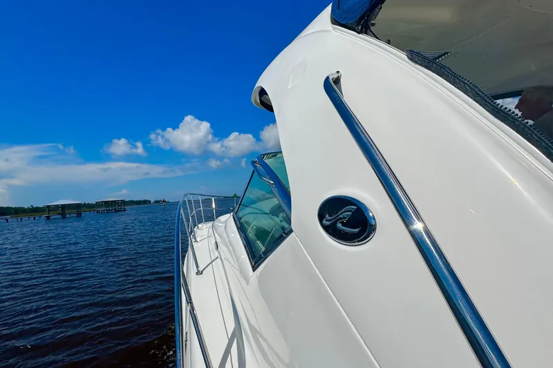  Yacht Photos Pics 2010 Sea Ray 390 Sundancer yacht cruising on a sunny day with blue skies.