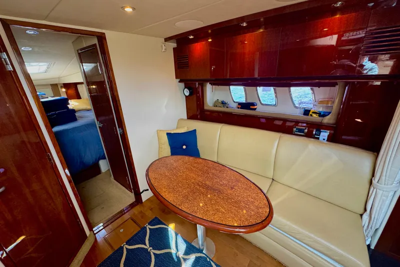  Yacht Photos Pics Luxurious interior of 2010 Sea Ray 390 Sundancer yacht with elegant seating and wooden finishes.