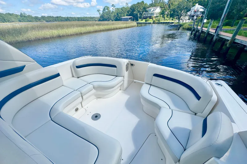  Yacht Photos Pics 2010 Sea Ray 390 Sundancer boat with spacious seating on a serene waterway.