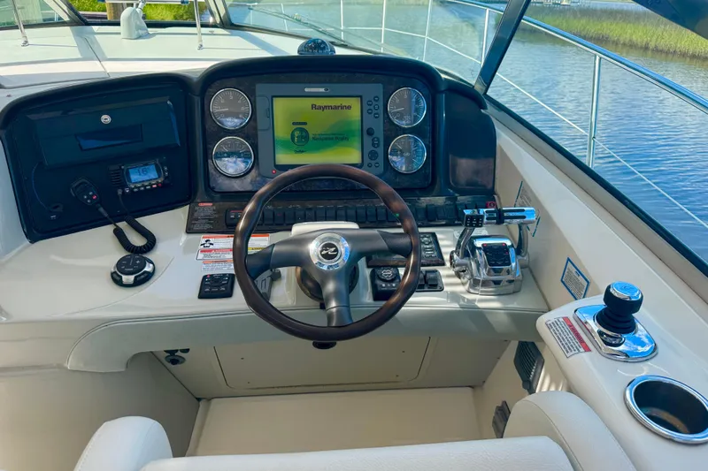  Yacht Photos Pics Cockpit of 2010 Sea Ray 390 Sundancer with navigation display and controls.