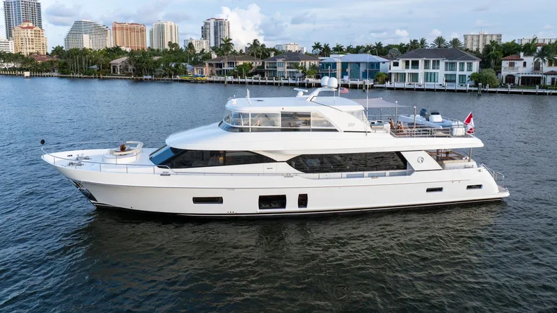 Iridescence Yacht Photos Pics Luxury 2020 Ocean Alexander 100 MY yacht cruising near waterfront homes.