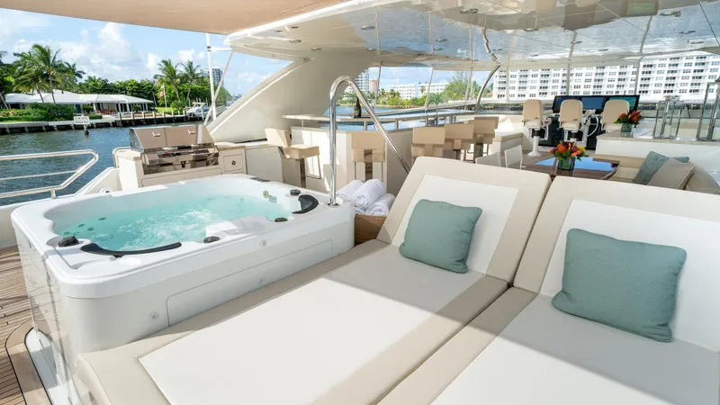 Iridescence Yacht Photos Pics Luxurious Ocean Alexander 100 MY yacht deck with jacuzzi and sun loungers, 2020 model.