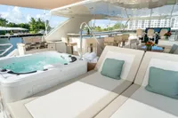 Luxurious Ocean Alexander 100 MY yacht deck with jacuzzi and sun loungers, 2020 model.