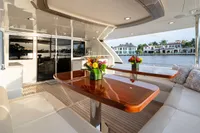 Luxurious Ocean Alexander 100 MY yacht deck with elegant seating and waterfront view, 2020 model.
