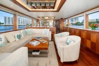 Luxurious interior of 2020 Ocean Alexander 100 MY yacht with elegant seating and waterfront views.