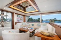 Luxurious interior of 2020 Ocean Alexander 100 MY yacht with elegant seating and waterfront view.