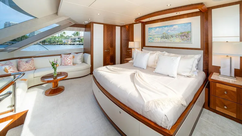 Iridescence Yacht Photos Pics Luxurious bedroom interior on 2020 Ocean Alexander 100 MY yacht, featuring elegant decor and waterfront view.