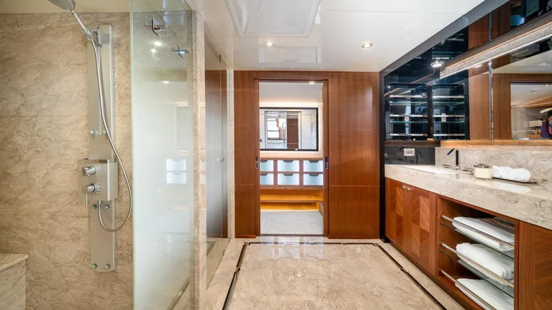 Iridescence Yacht Photos Pics Luxurious bathroom on 2020 Ocean Alexander 100 MY yacht with marble and wood finishes.