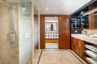 Luxurious bathroom on 2020 Ocean Alexander 100 MY yacht with marble and wood finishes.