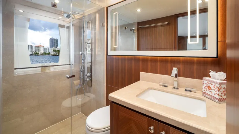 Iridescence Yacht Photos Pics Luxurious bathroom on 2020 Ocean Alexander 100 MY yacht with modern fixtures and ocean view.