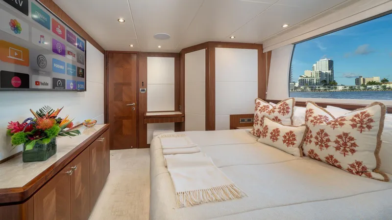 Iridescence Yacht Photos Pics Luxurious Ocean Alexander 100 MY 2020 yacht bedroom with elegant decor and waterfront view.