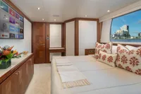 Luxurious Ocean Alexander 100 MY 2020 yacht bedroom with elegant decor and waterfront view.