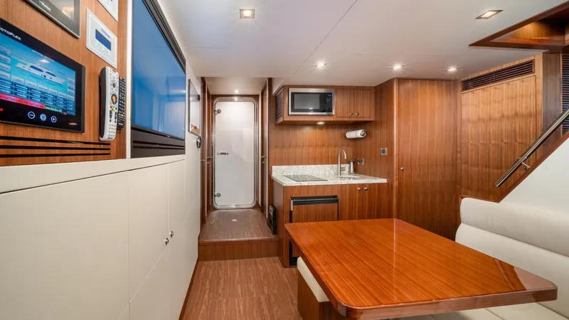 Iridescence Yacht Photos Pics Luxurious interior of 2020 Ocean Alexander 100 MY yacht with modern kitchen and dining area.