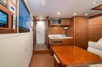 Luxurious interior of 2020 Ocean Alexander 100 MY yacht with modern kitchen and dining area.