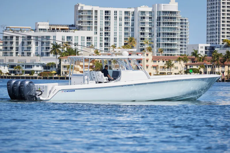  Yacht Photos Pics 2022 Contender 44 Fisharound boat cruising near city waterfront.