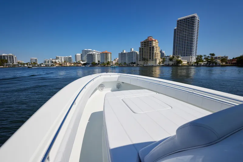  Yacht Photos Pics 2022 Contender 44 Fisharound cruising near city skyline on a sunny day.