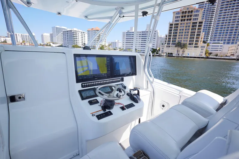  Yacht Photos Pics Helm of 2022 Contender 44 Fisharound boat with modern navigation equipment.