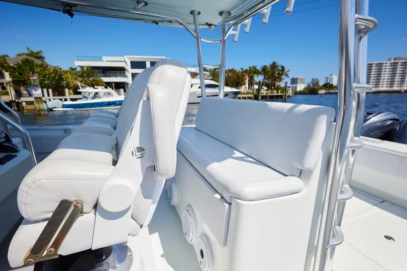  Yacht Photos Pics 2022 Contender 44 Fisharound boat with white seating and sleek design on a sunny day.