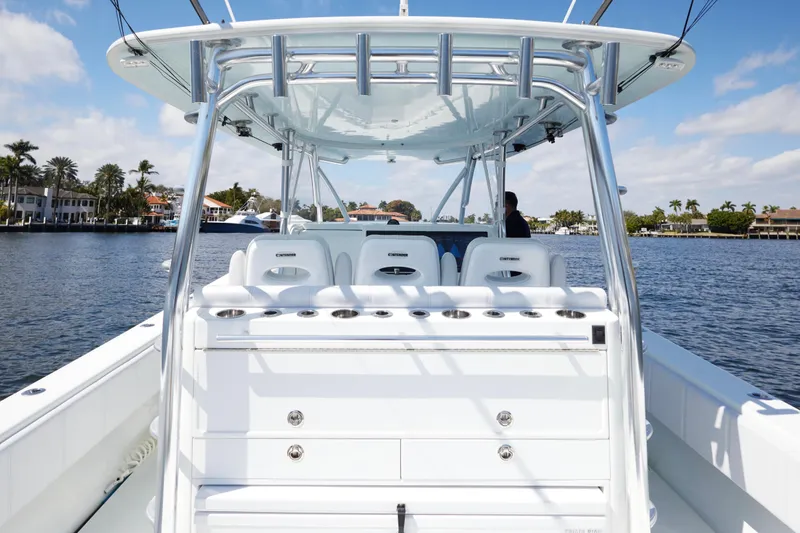  Yacht Photos Pics 2022 Contender 44 Fisharound boat on water, featuring sleek design and spacious deck.