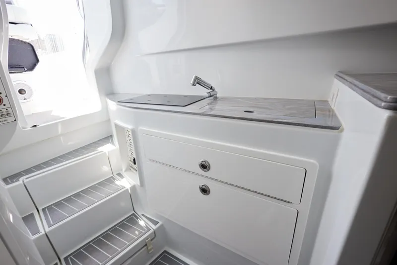  Yacht Photos Pics 2022 Contender 44 Fisharound interior with sleek cabinetry and modern design.