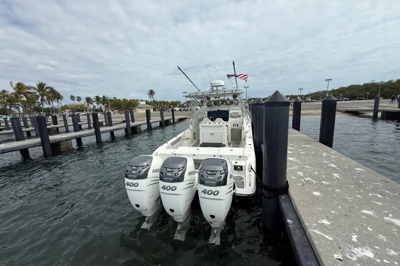  Yacht Photos Pics 2010 Triton 351 Express boat docked with triple 400 horsepower engines.