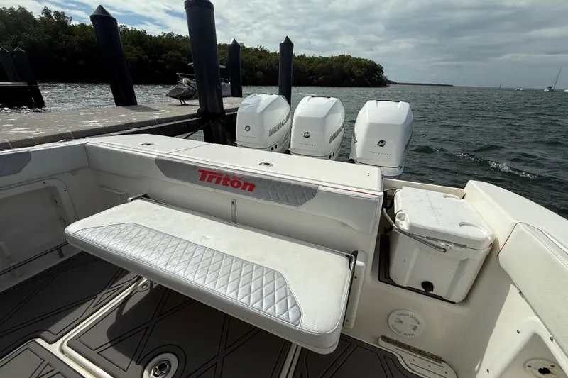  Yacht Photos Pics 2010 Triton 351 Express boat with triple Mercury outboard engines at dock.