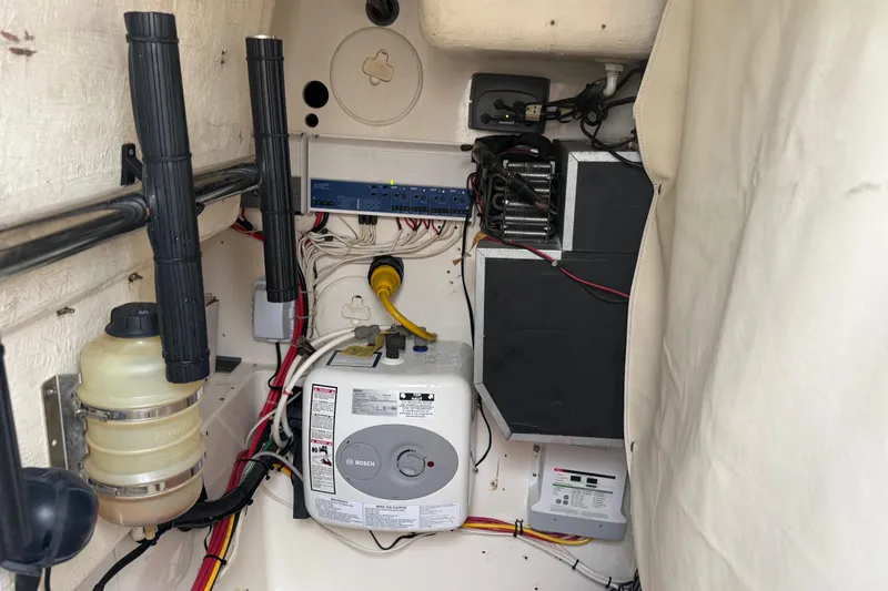  Yacht Photos Pics 2010 Triton 351 Express boat interior showing electrical and mechanical components.
