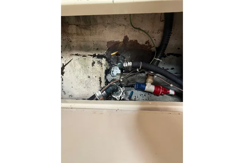  Yacht Photos Pics Bilge area of 2010 Triton 351 Express boat showing hoses and fittings.