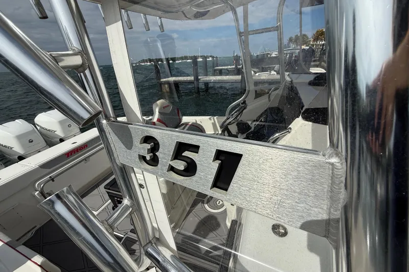  Yacht Photos Pics 2010 Triton 351 Express boat with sleek metallic design and powerful engines.